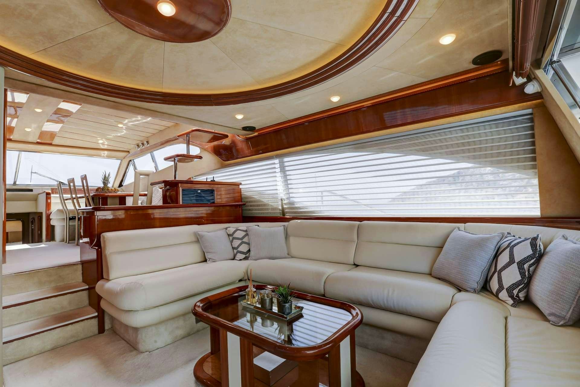 a living room with a couch and a coffee table aboard ALSIUM Yacht for Charter