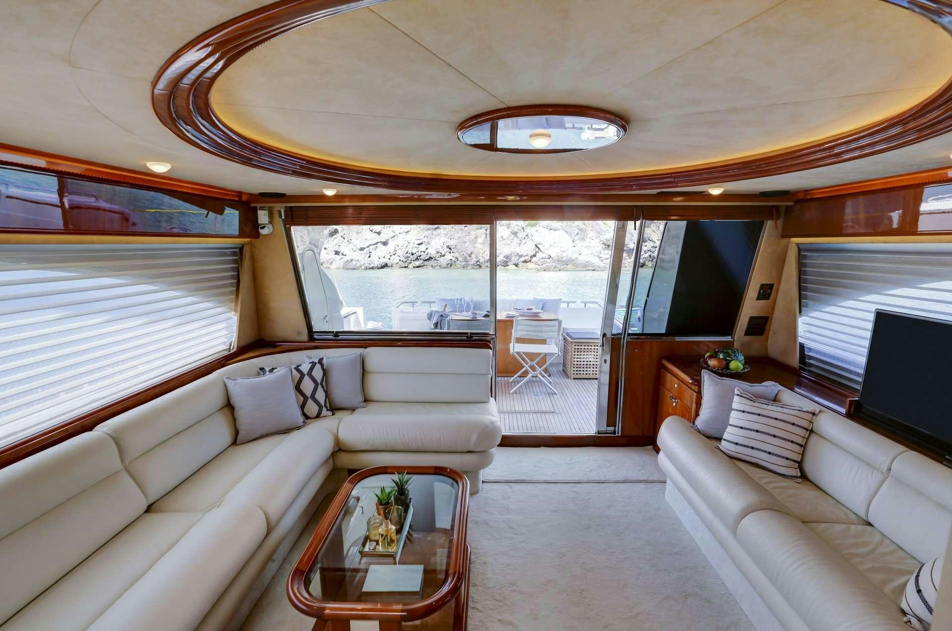 a large living room with a large window aboard ALSIUM Yacht for Charter