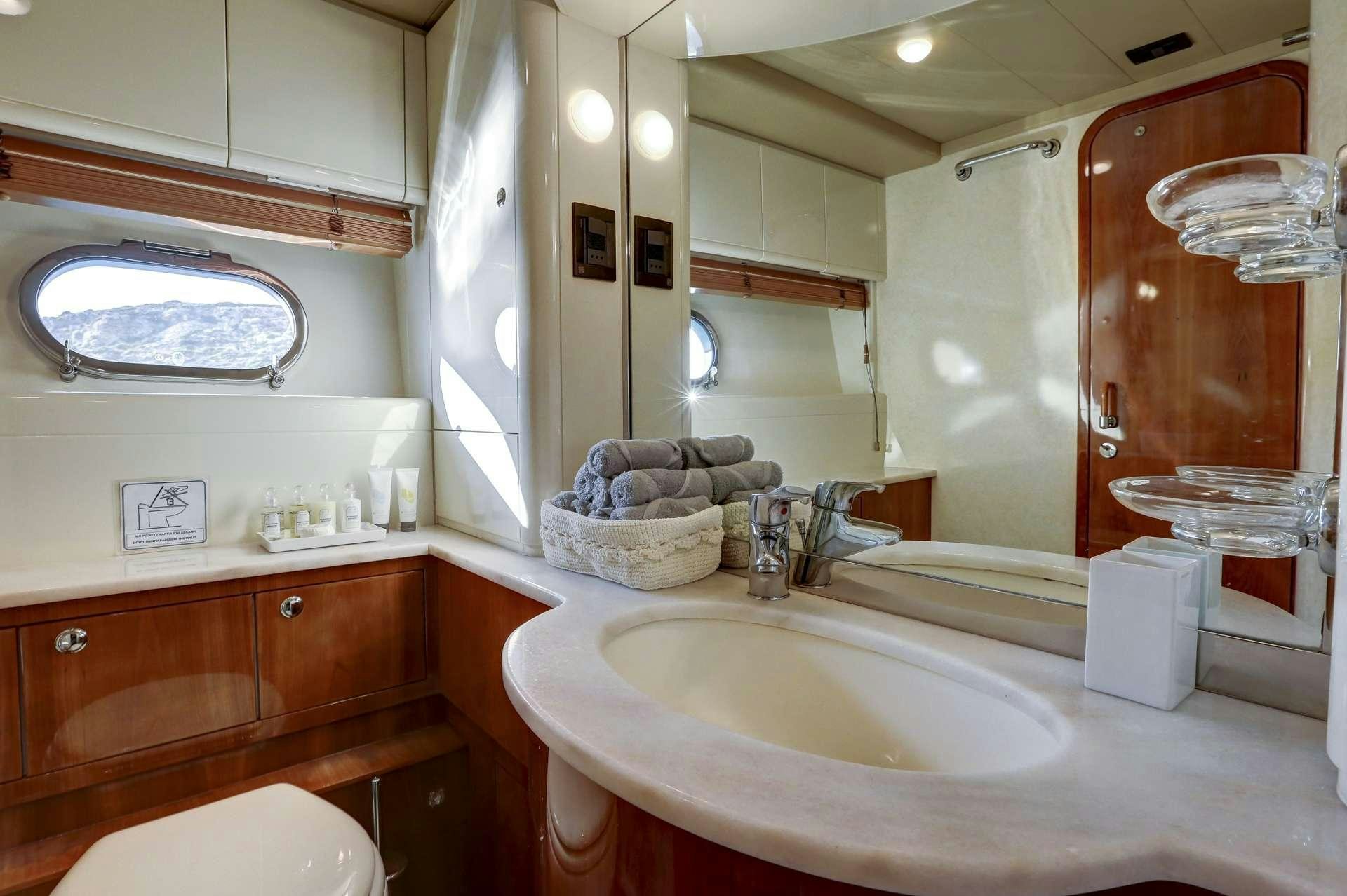a bathroom with a large mirror aboard ALSIUM Yacht for Charter