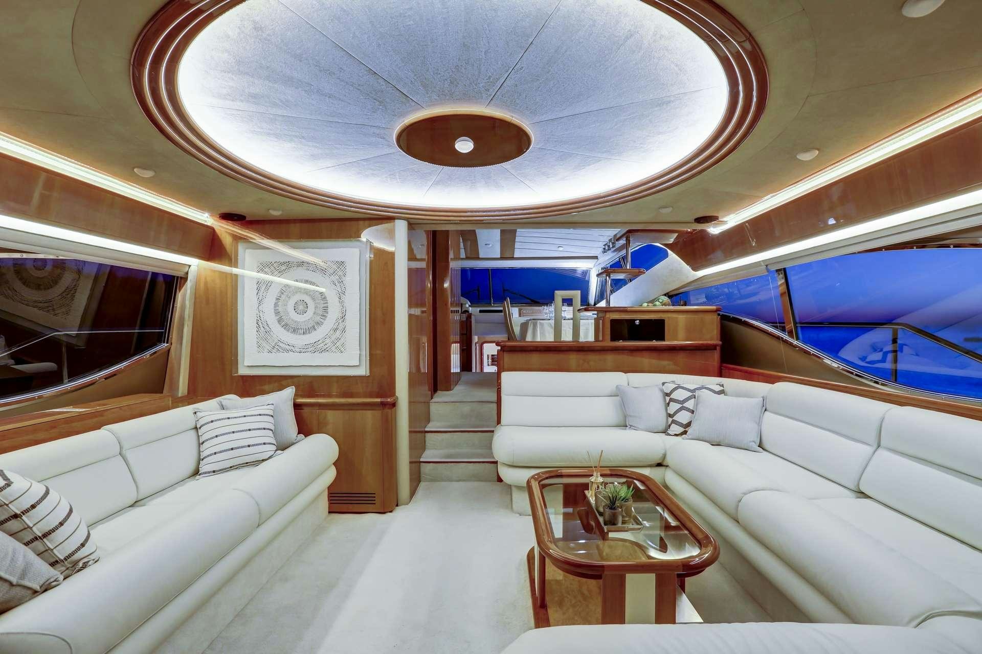 a room with a couch and a table aboard ALSIUM Yacht for Charter