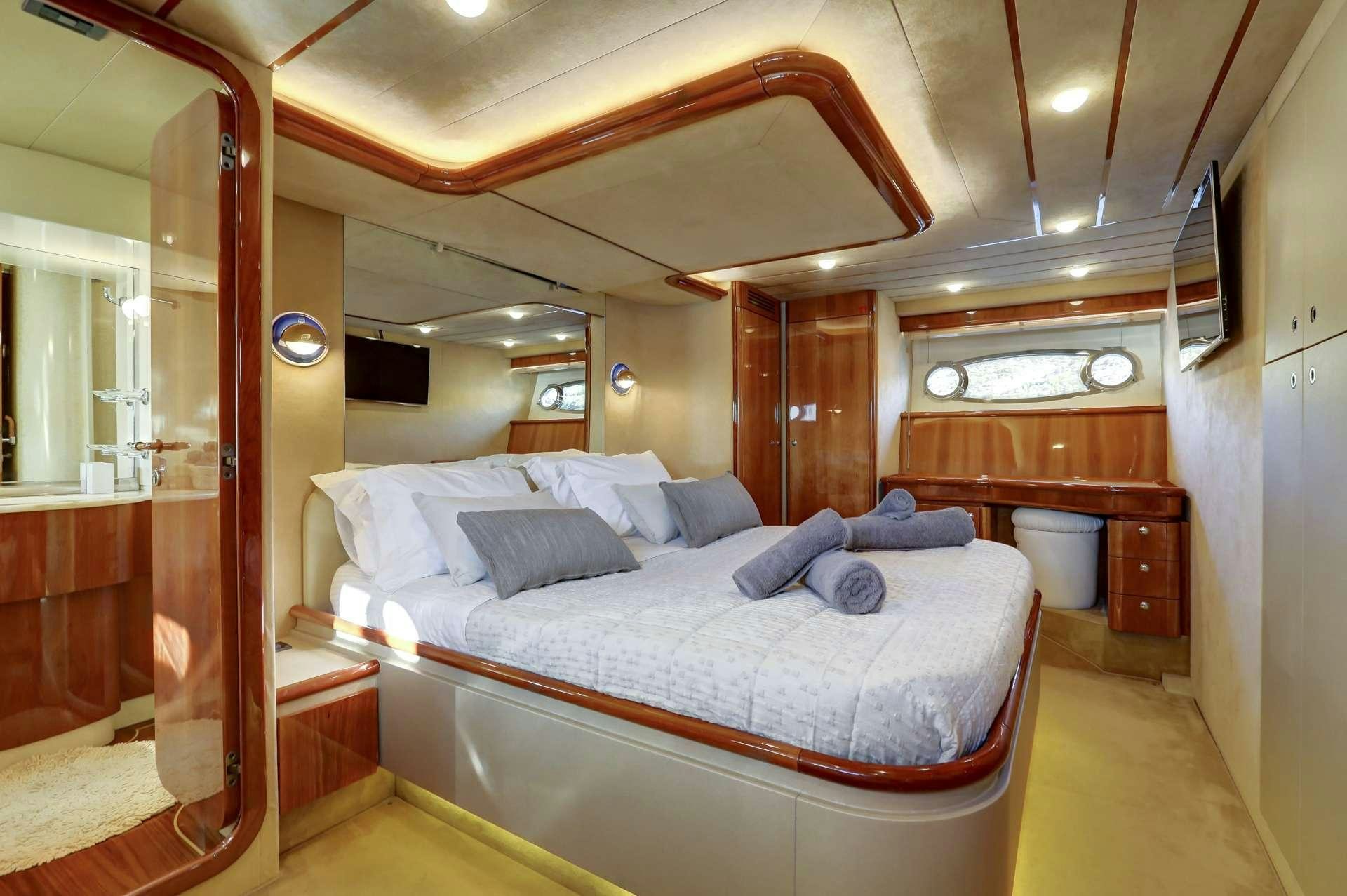 a bed in a room aboard ALSIUM Yacht for Charter