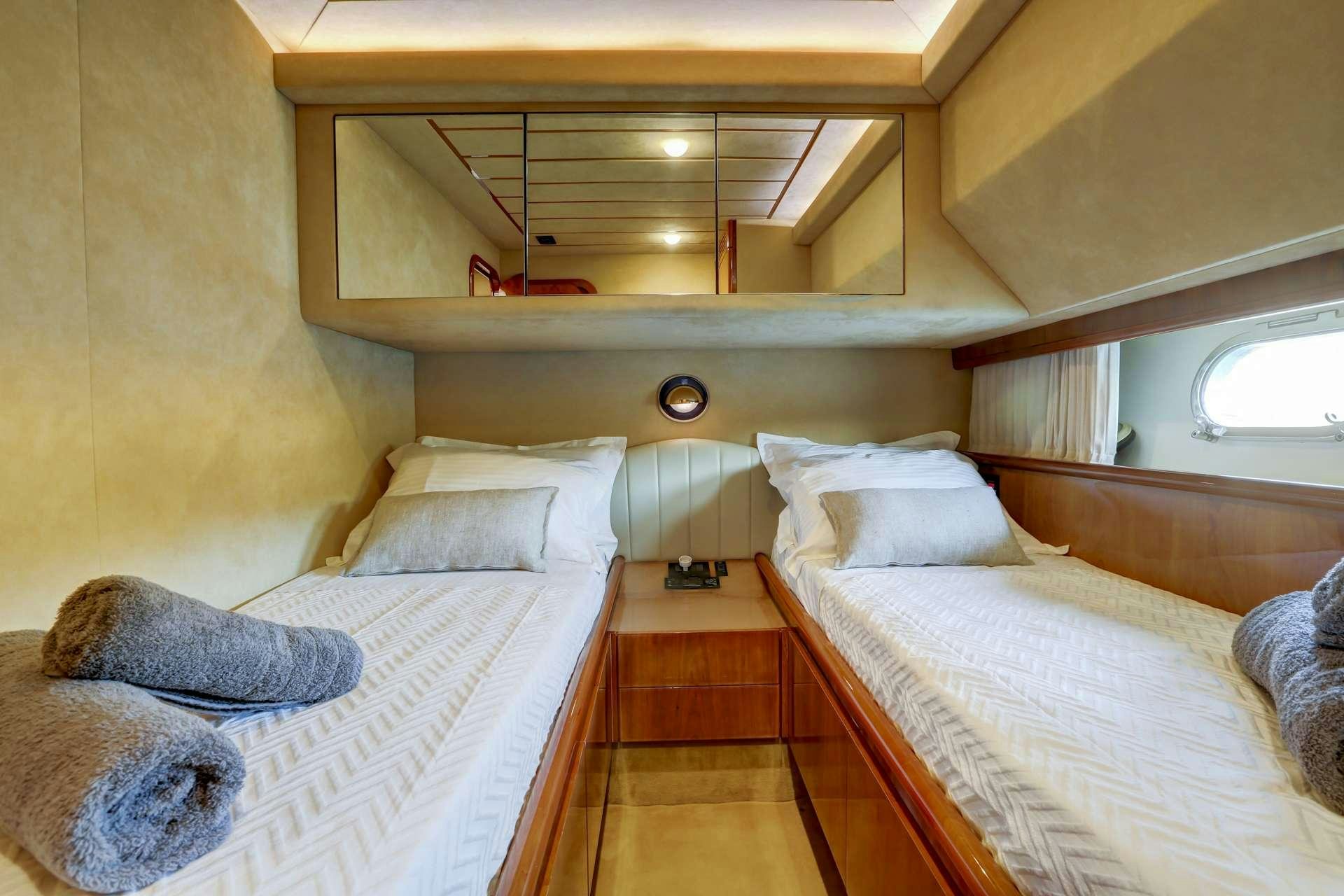 a couple of beds in a room aboard ALSIUM Yacht for Charter