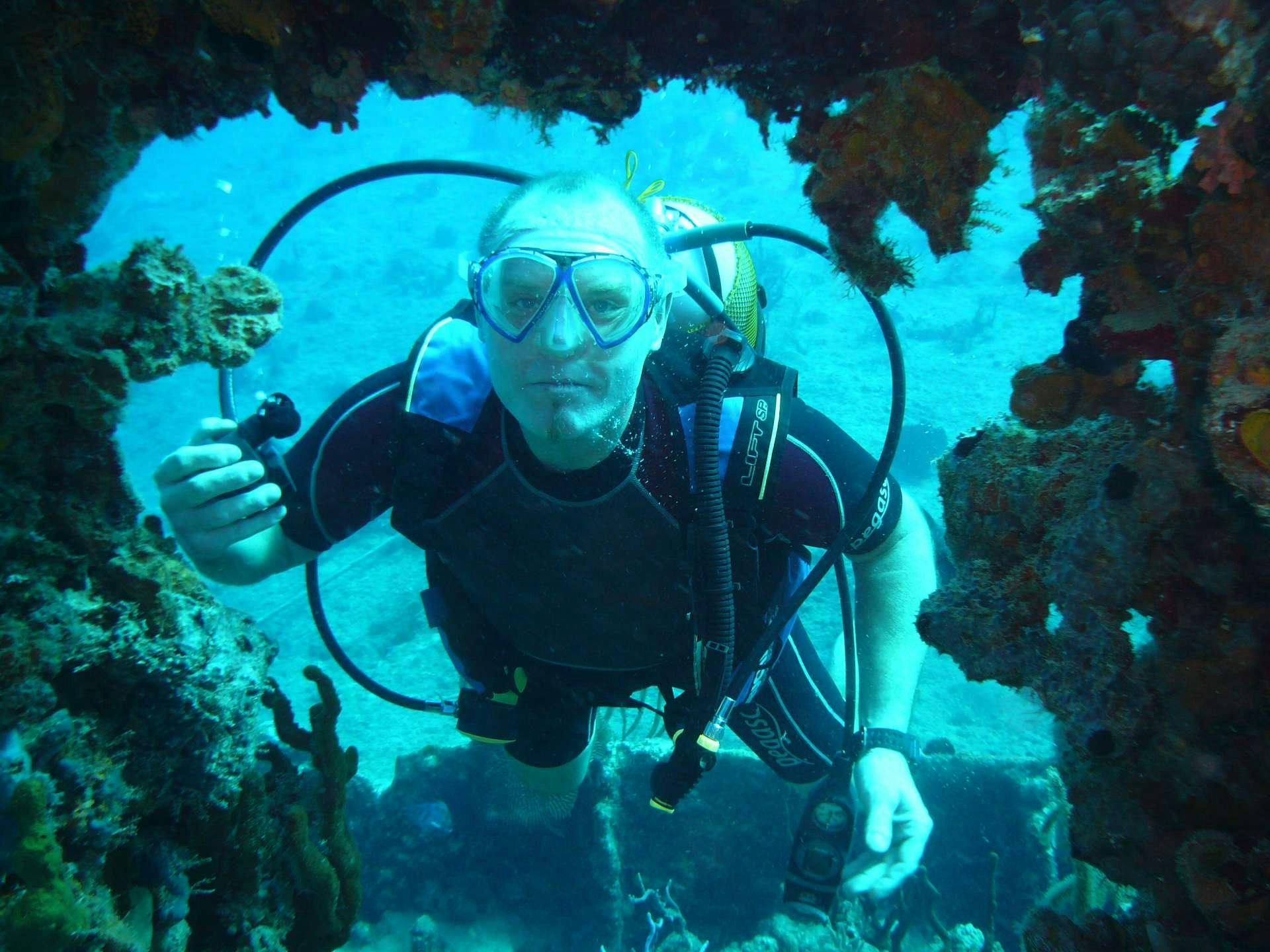 a person in scuba gear underwater aboard EXTASEA 2 Yacht for Charter