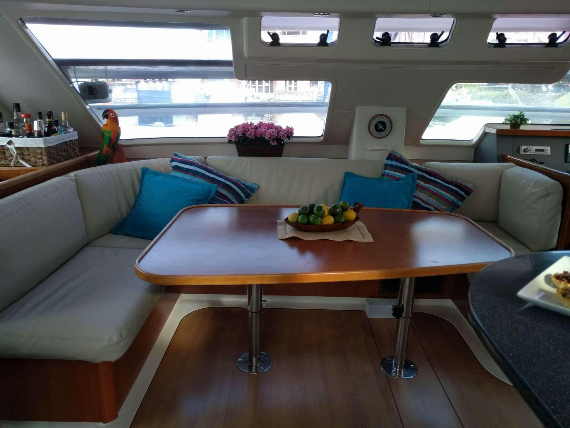 a table with a bowl of fruit on it aboard EXTASEA 2 Yacht for Charter