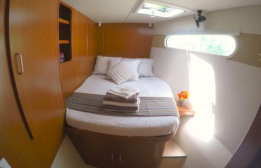 a bed in a room aboard EXTASEA 2 Yacht for Charter