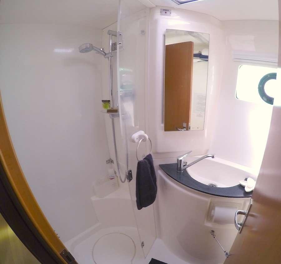 a bathroom with a sink and a mirror aboard EXTASEA 2 Yacht for Charter