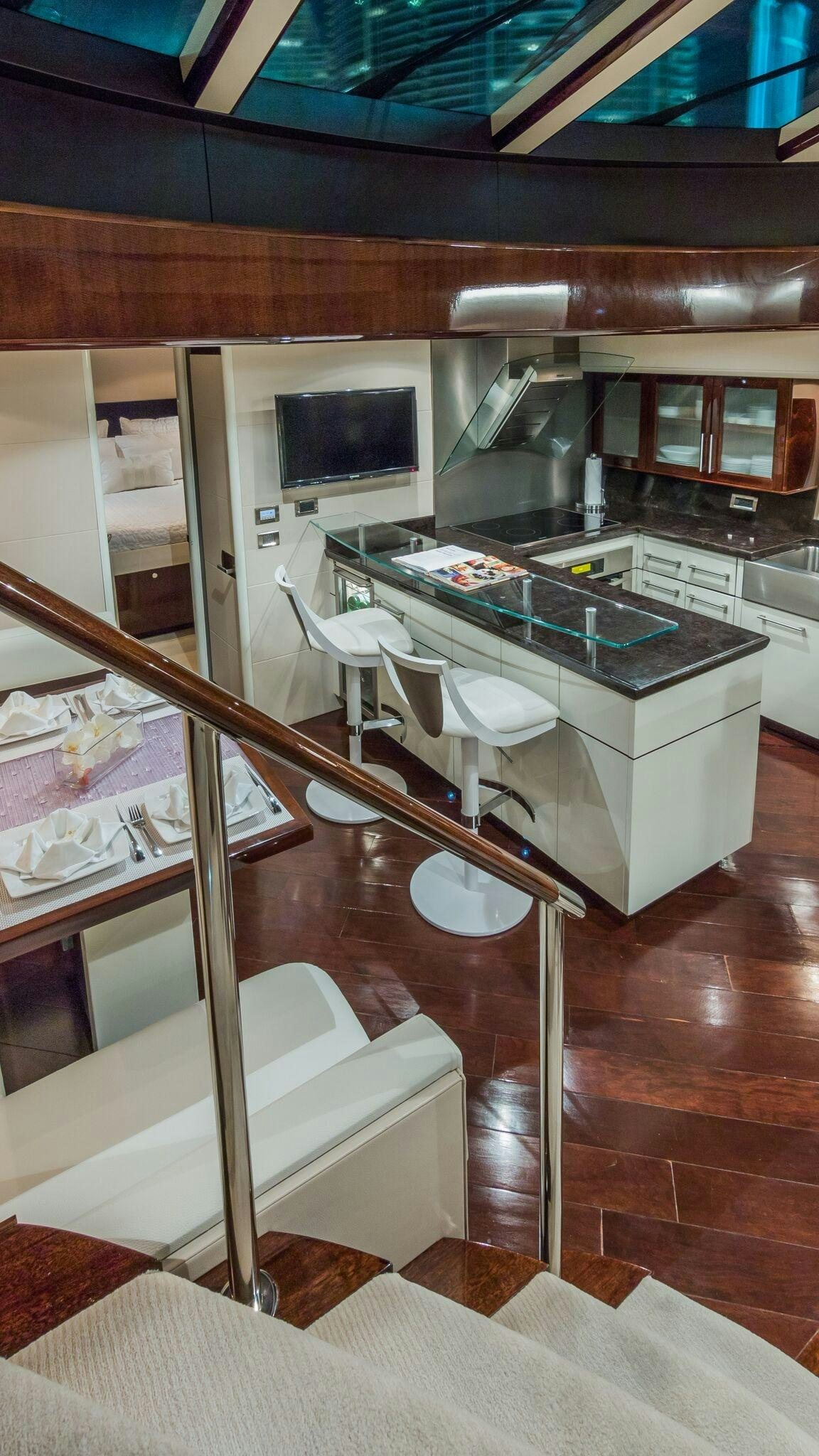 a kitchen with a table and chairs aboard CARPE DIEM Yacht for Charter