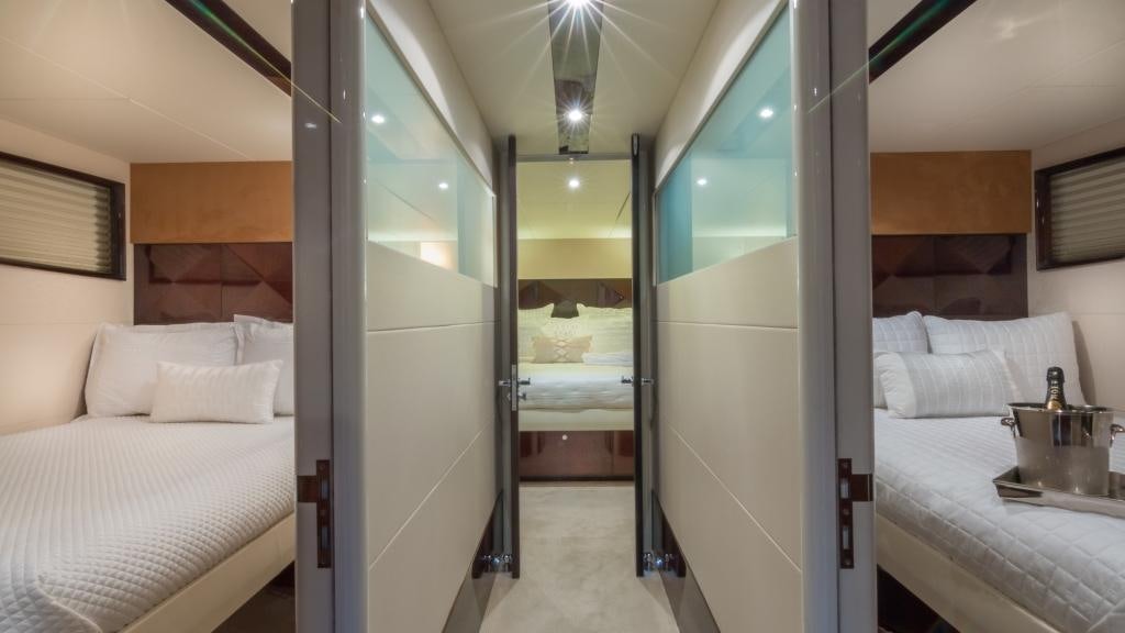 a room with a bed and a mirror aboard CARPE DIEM Yacht for Charter