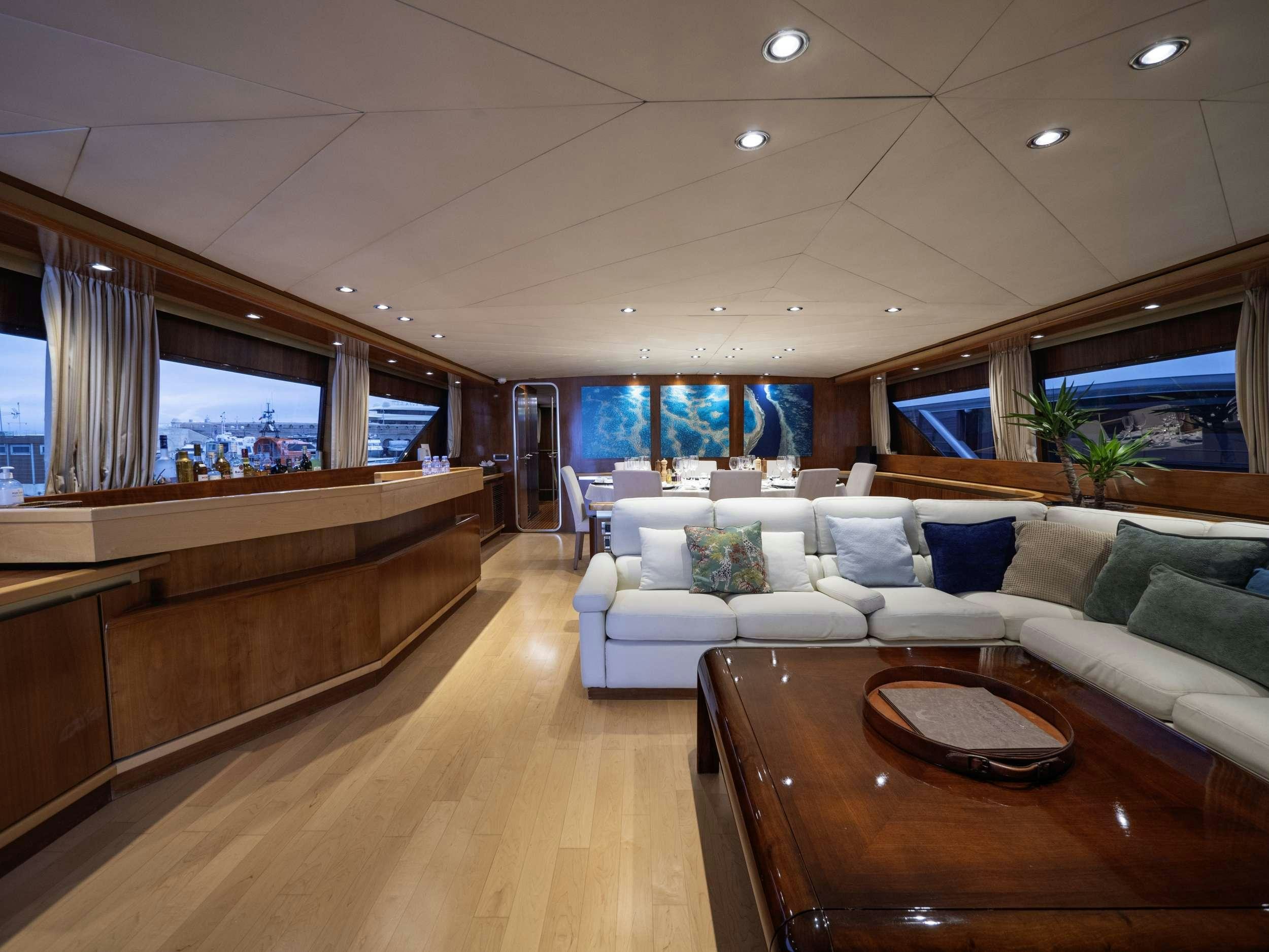 a living room with a couch and a table aboard SUNLINER X Yacht for Charter