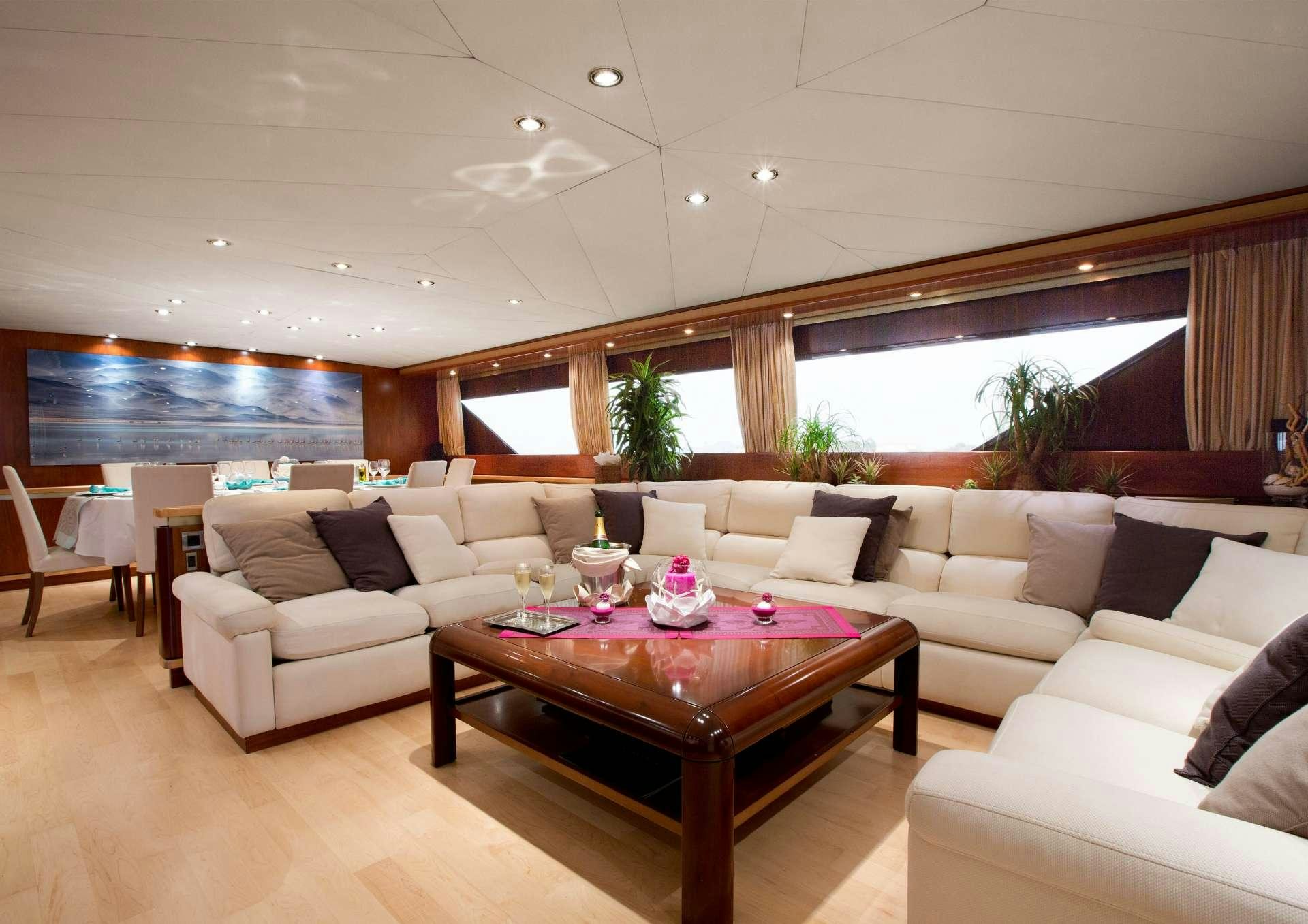 a living room with a large window aboard SUNLINER X Yacht for Charter