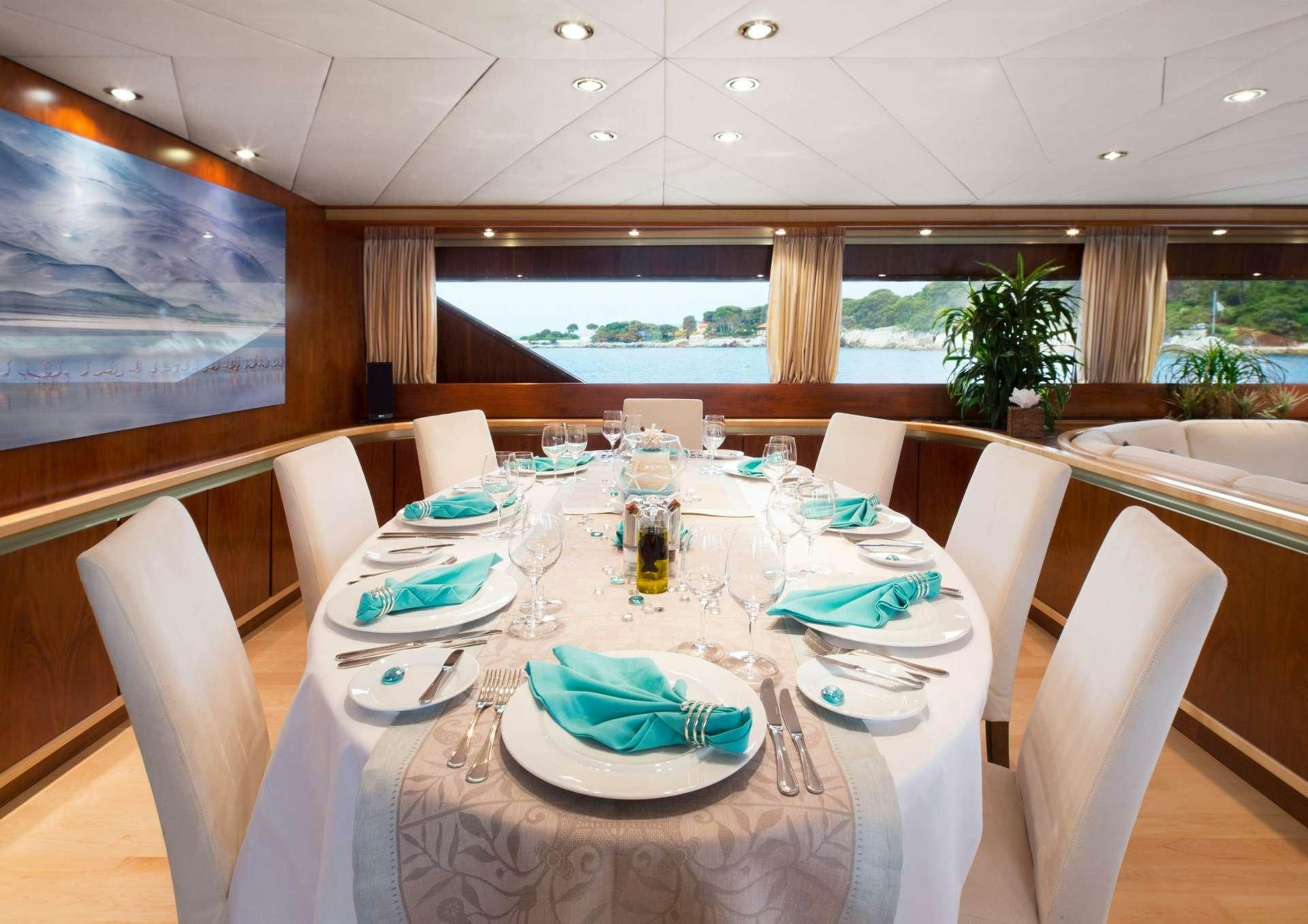 a table set for a dinner aboard SUNLINER X Yacht for Charter