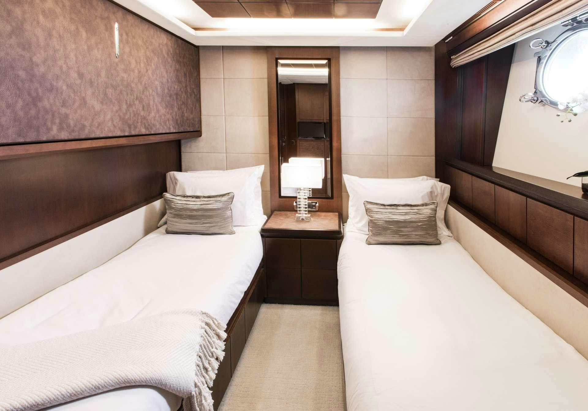 a room with two beds aboard TAIL LIGHTS Yacht for Charter