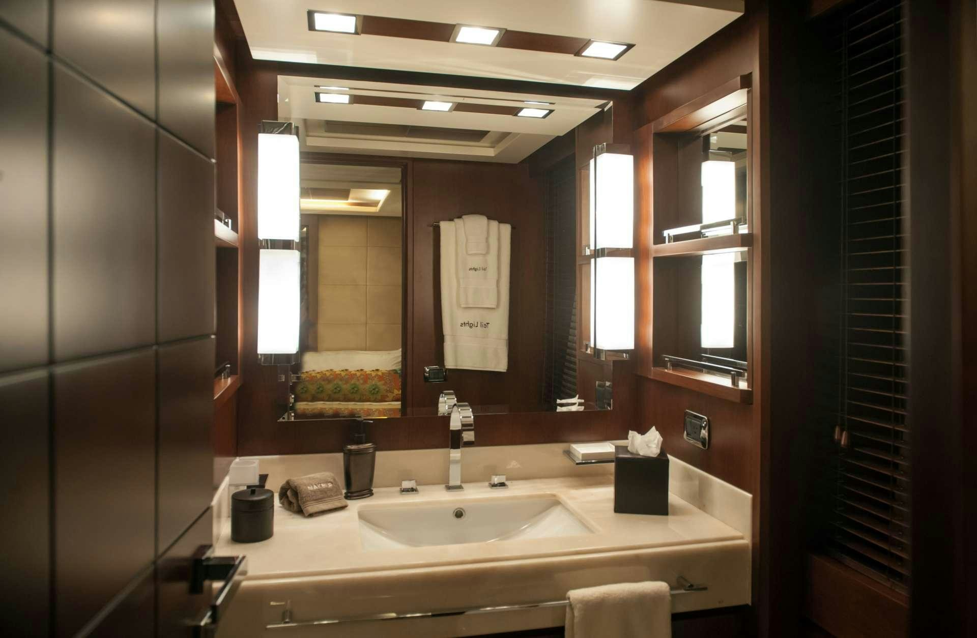 a bathroom with a large mirror aboard TAIL LIGHTS Yacht for Charter