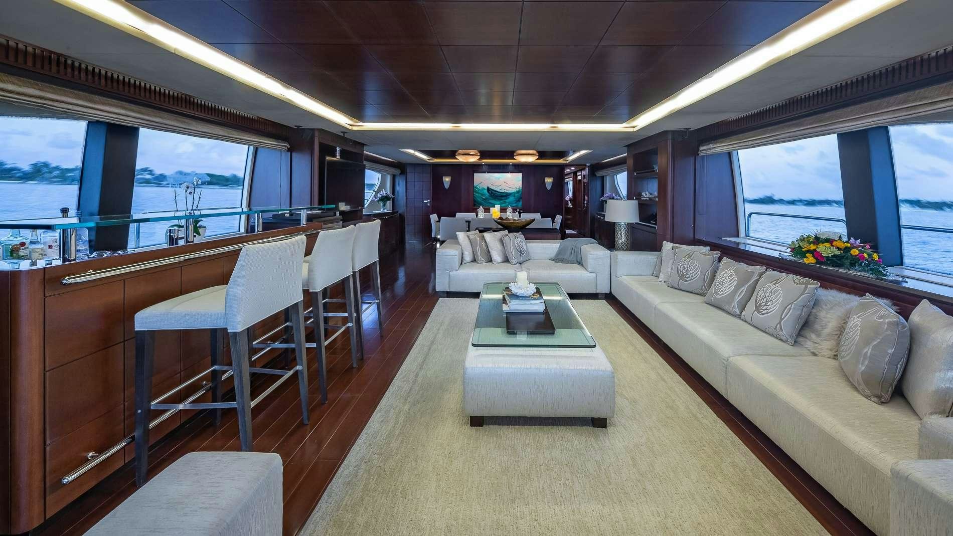 a living room with a large window aboard TAIL LIGHTS Yacht for Charter