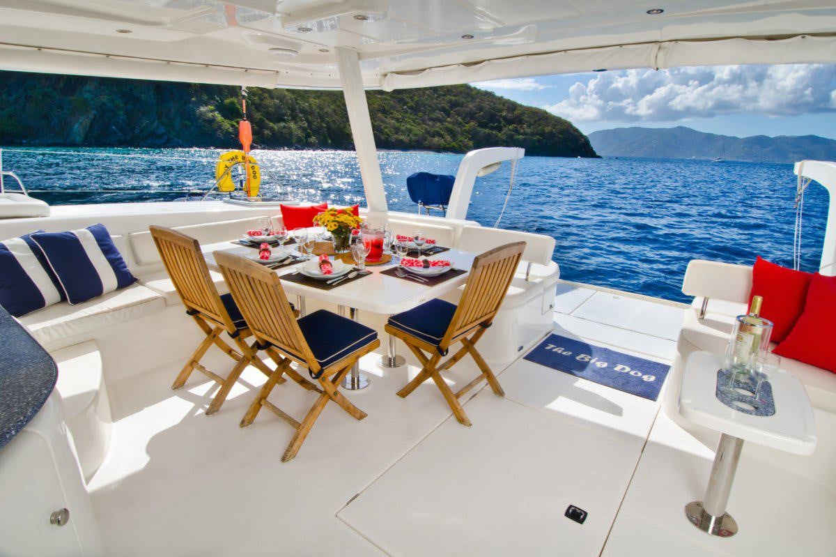 a table on a boat aboard THE BIG DOG Yacht for Charter