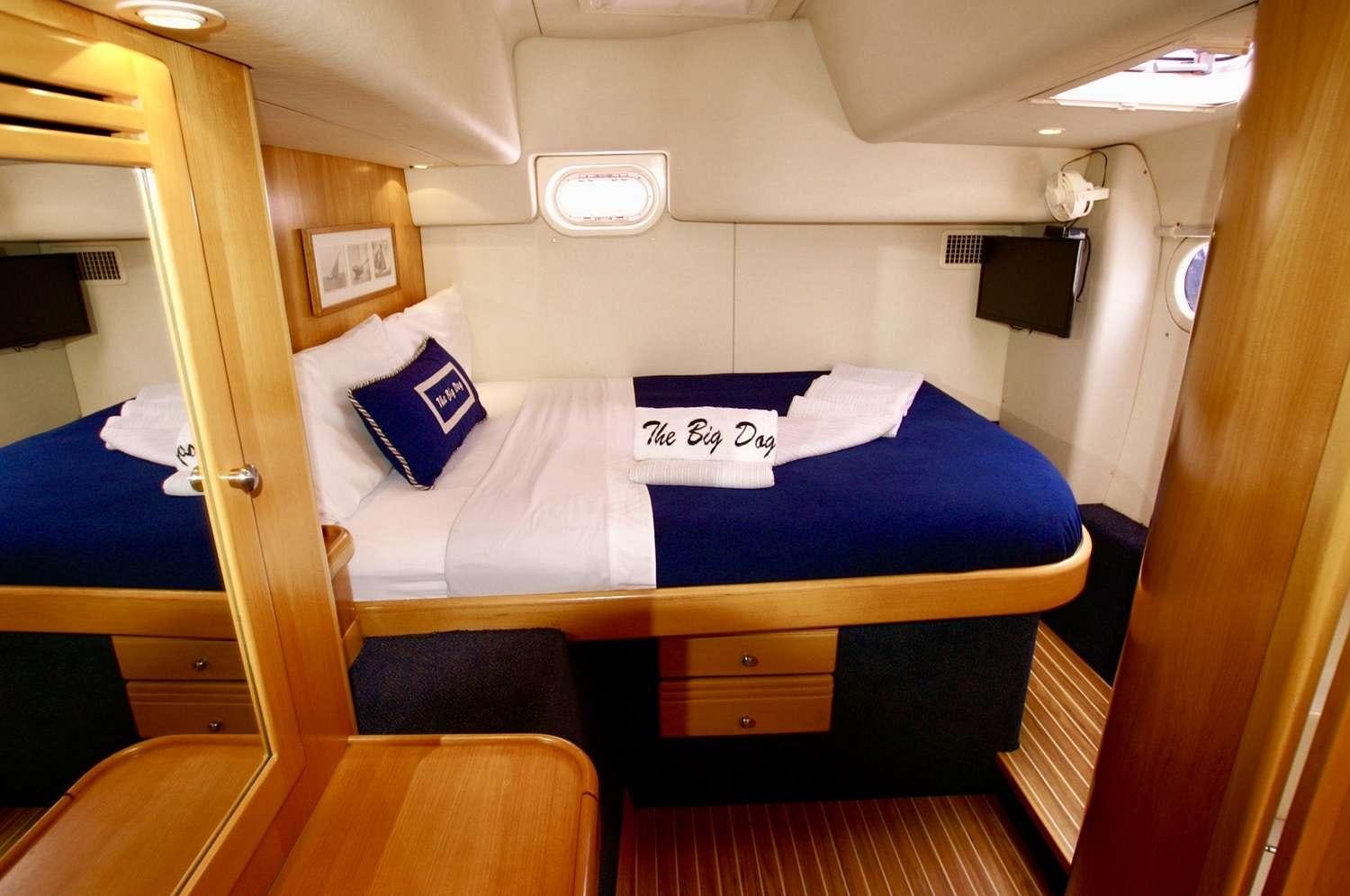 a bed in a room aboard THE BIG DOG Yacht for Charter