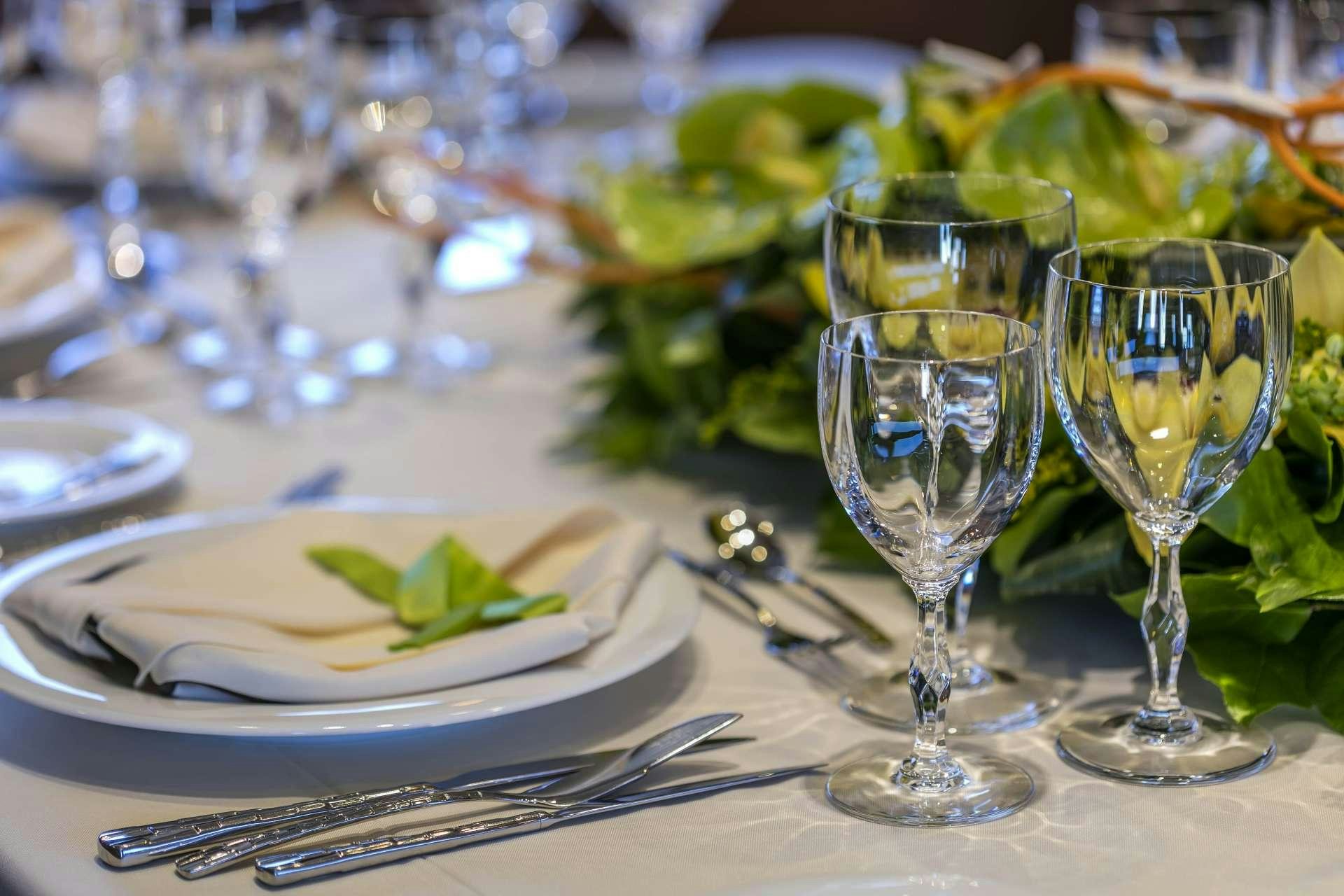 a table with plates and glasses aboard ALEXIA AV Yacht for Charter