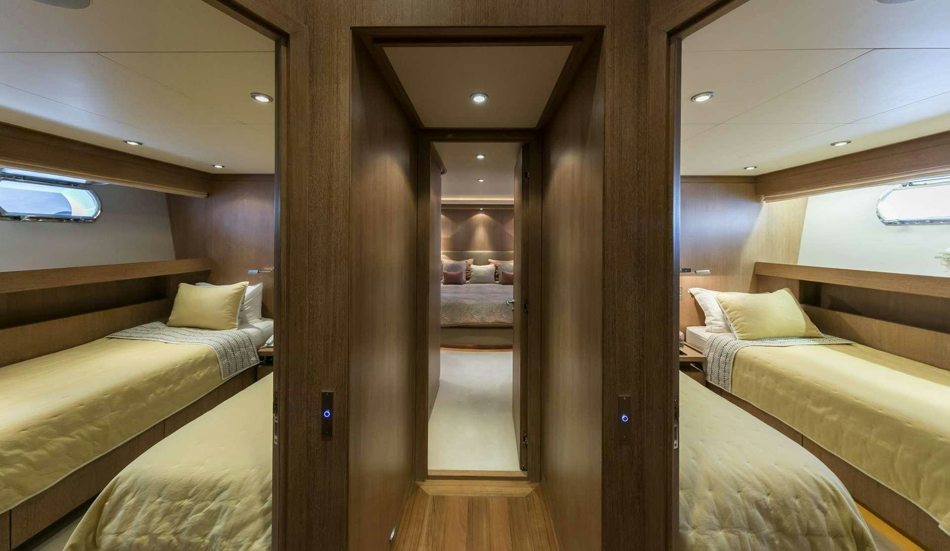 a room with a bed and a mirror aboard ALEXIA AV Yacht for Charter