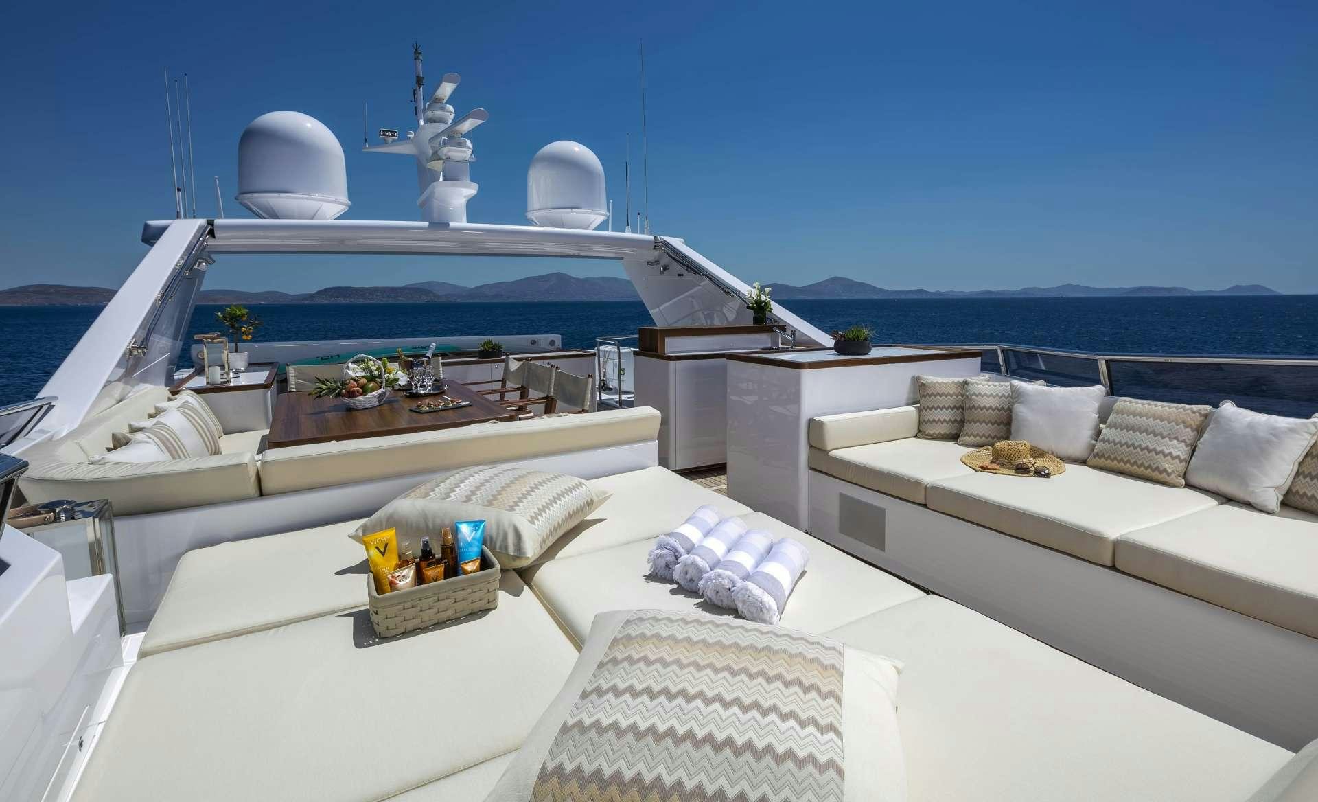 a room with a bed and a large white bed and a large white building with a large white aboard ALEXIA AV Yacht for Charter