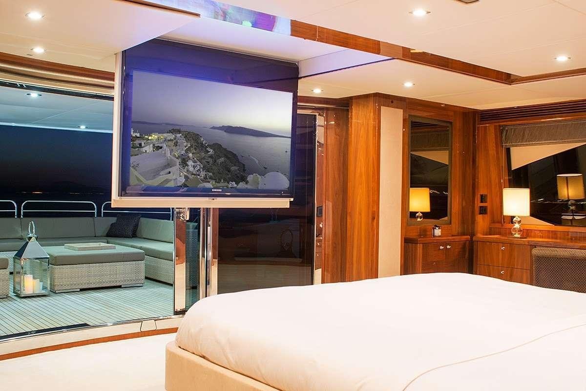a large hotel room with a large fish tank aboard PATHOS Yacht for Charter