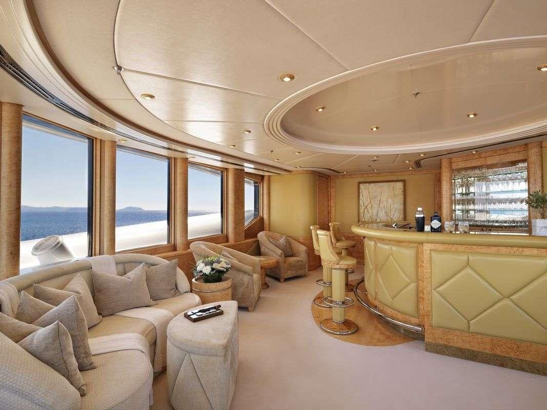 a living room with a large window aboard CAPRI I Yacht for Charter