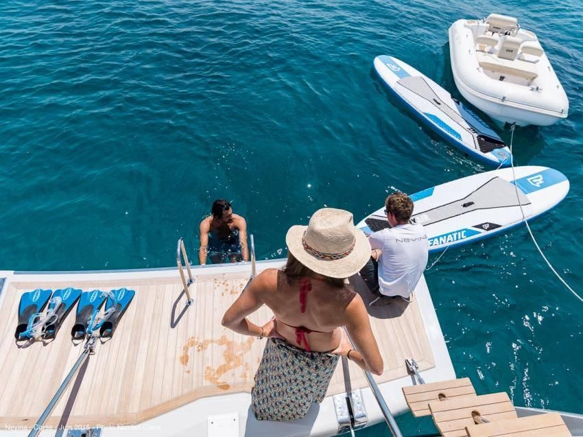 a group of people on a boat aboard NEYINA Yacht for Charter