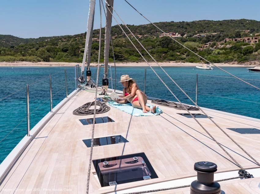 a person sitting on a boat aboard NEYINA Yacht for Charter
