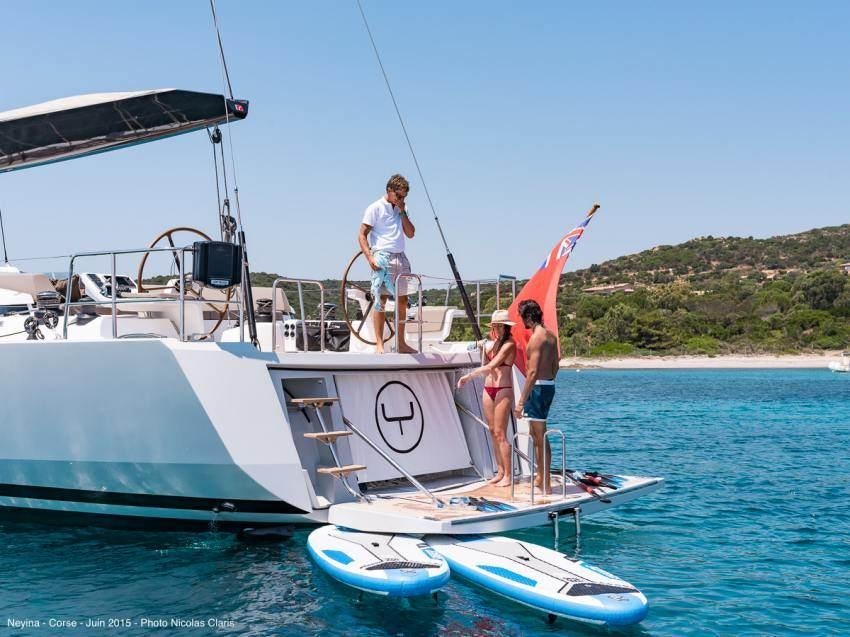 a group of people on a boat aboard NEYINA Yacht for Charter