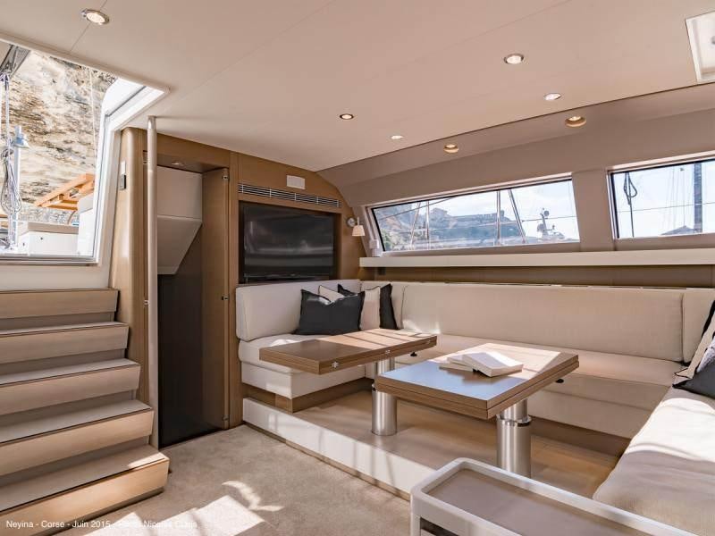 a living room with a couch and a table aboard NEYINA Yacht for Charter