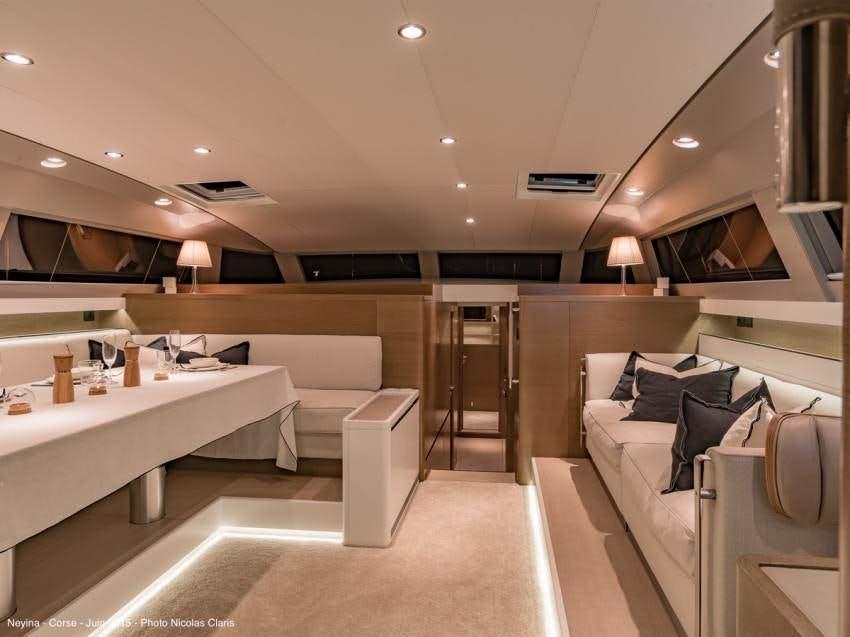 a room with a large white counter and a white sofa aboard NEYINA Yacht for Charter