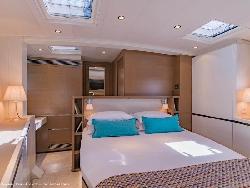 a hotel room with a bed aboard NEYINA Yacht for Charter