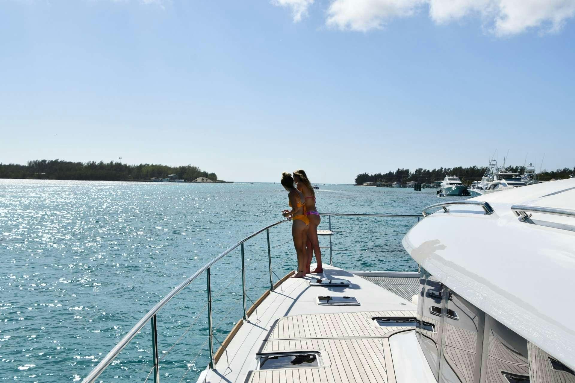 a man standing on a boat aboard LONG MONDAY Yacht for Charter