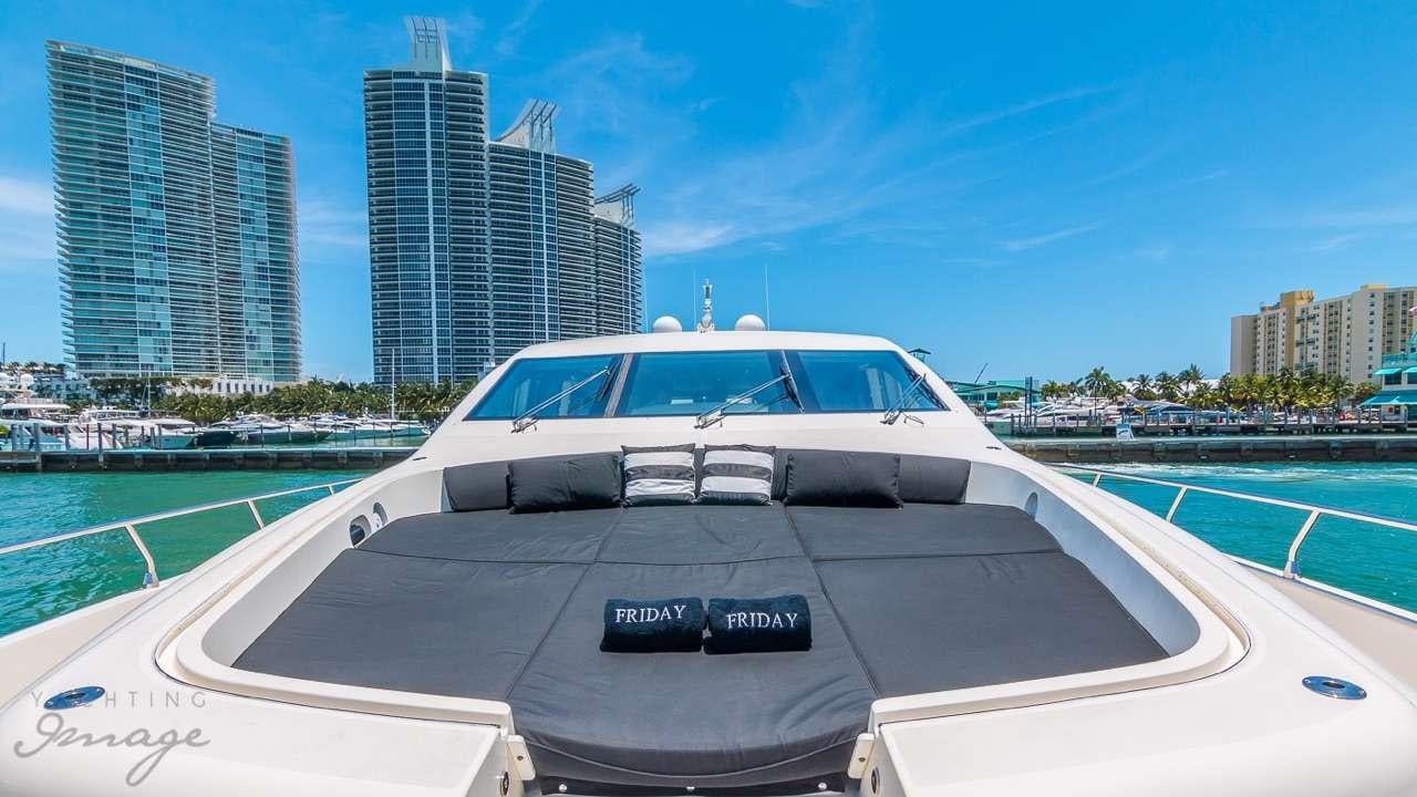 a white yacht on a deck aboard FRIDAY Yacht for Charter