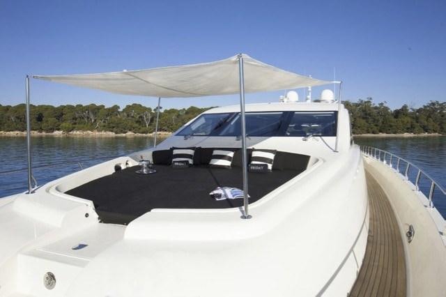 a white boat on a dock aboard FRIDAY Yacht for Charter