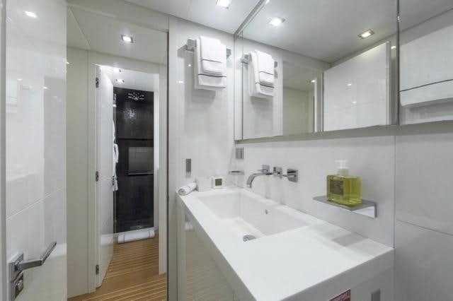 a bathroom with a large mirror aboard FRIDAY Yacht for Charter