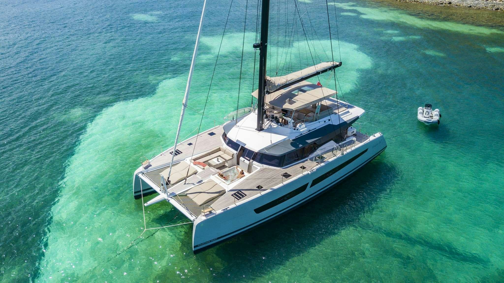 a boat sailing on the water aboard LISA OF THE SEAS Yacht for Charter