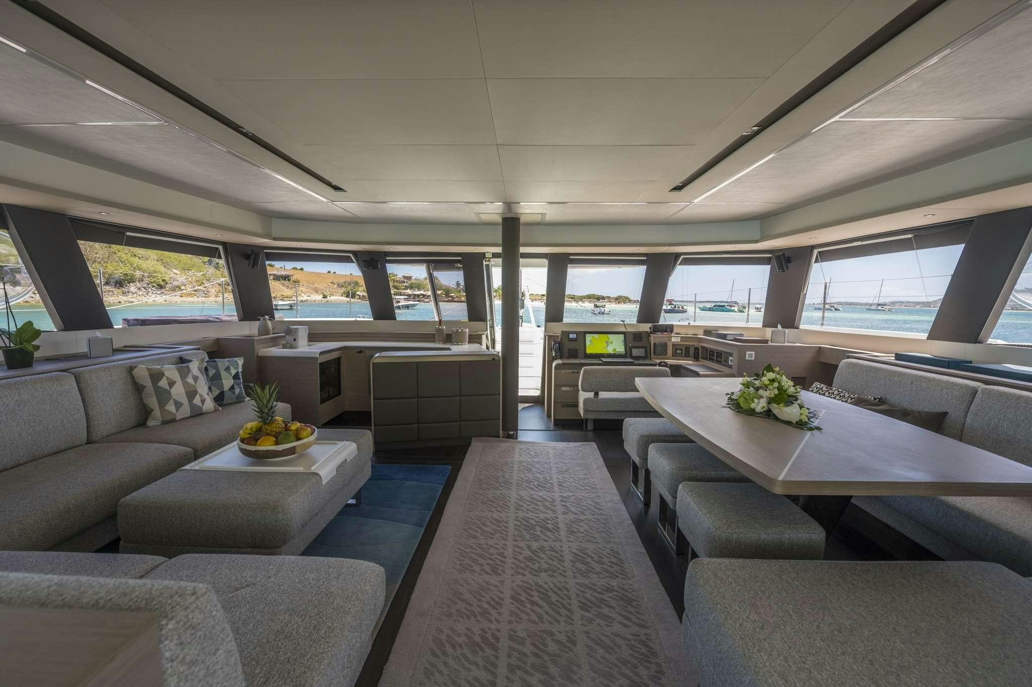 a room with couches and a table aboard LISA OF THE SEAS Yacht for Charter
