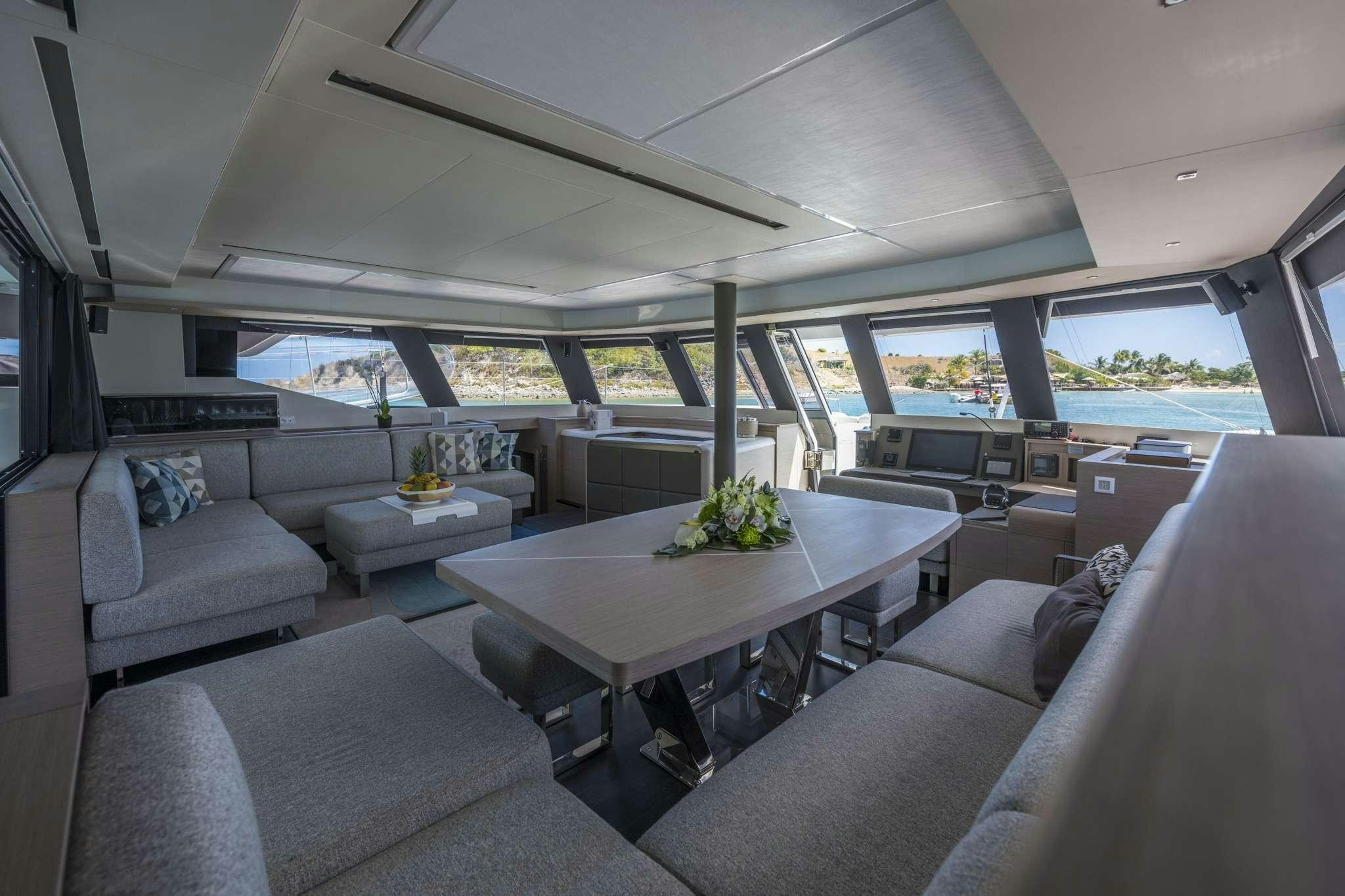 a room with a couch and a table aboard LISA OF THE SEAS Yacht for Charter