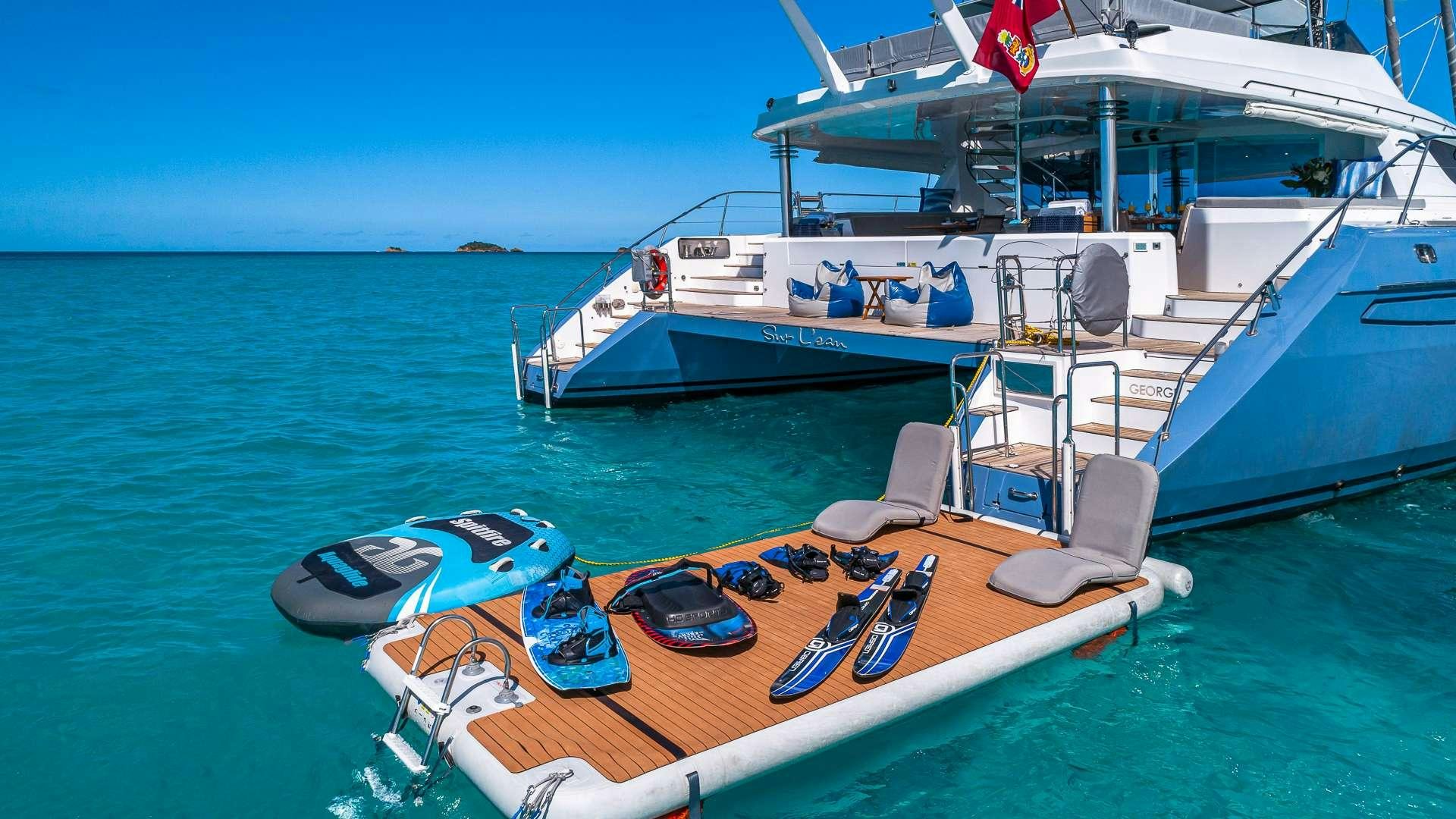 a boat docked at a pier aboard SUR L'EAU Yacht for Charter