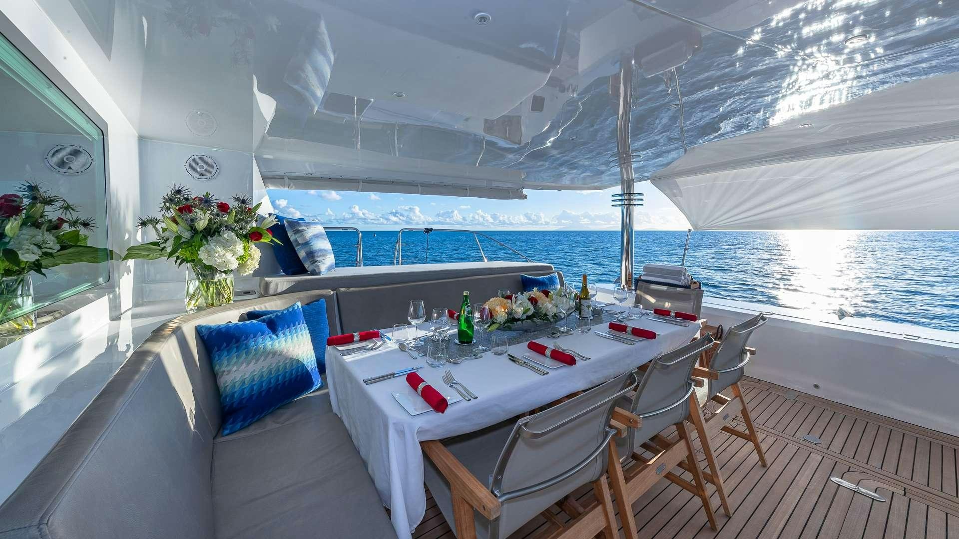 a table and chairs on a boat aboard SUR L'EAU Yacht for Charter
