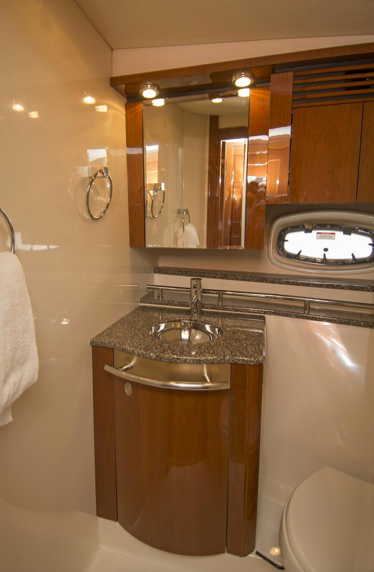 a bathroom with a sink and a mirror aboard PIER PRESSURE Yacht for Charter