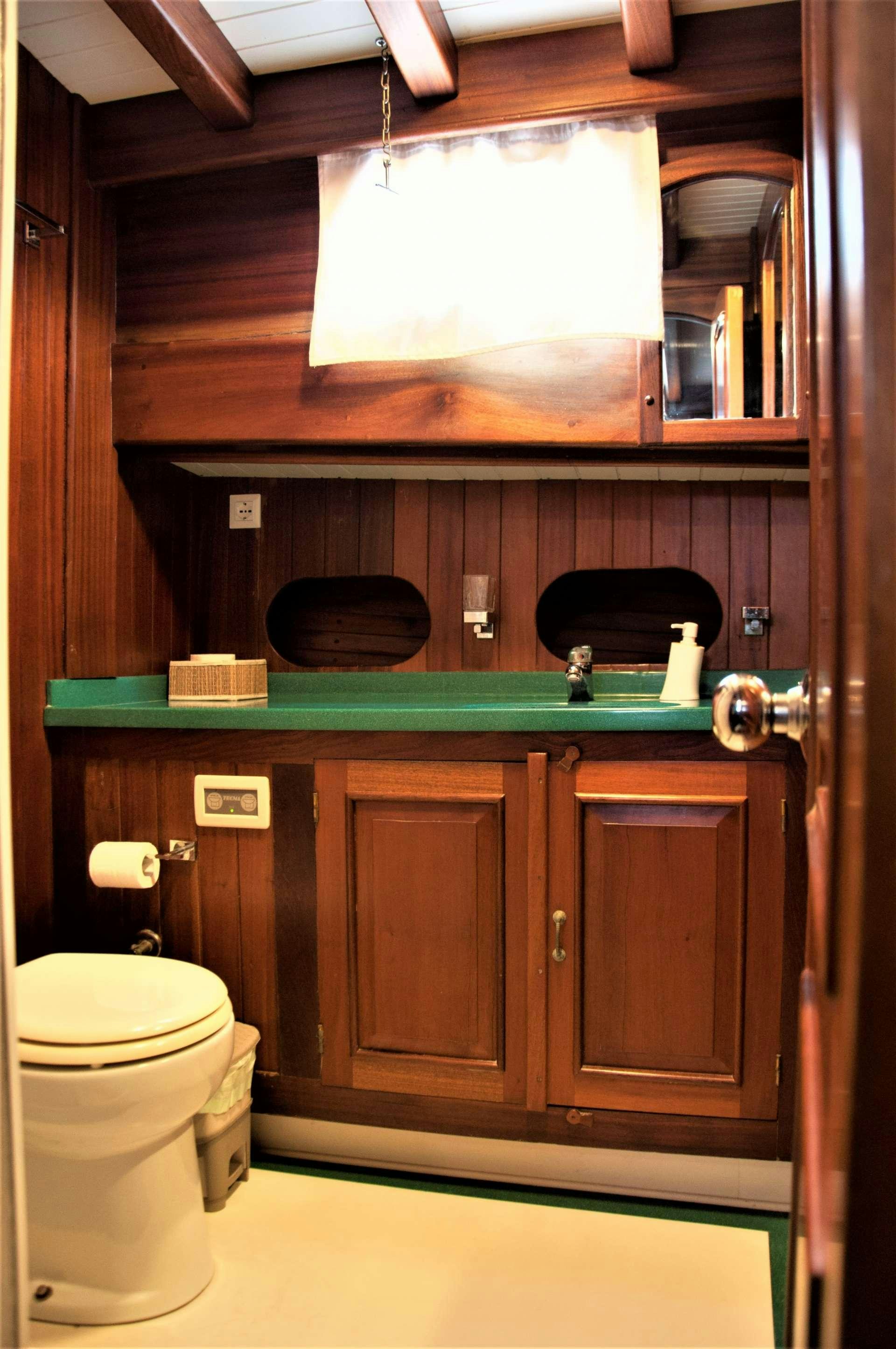 a bathroom with a toilet and a sink aboard Donna Marisa Yacht for Charter
