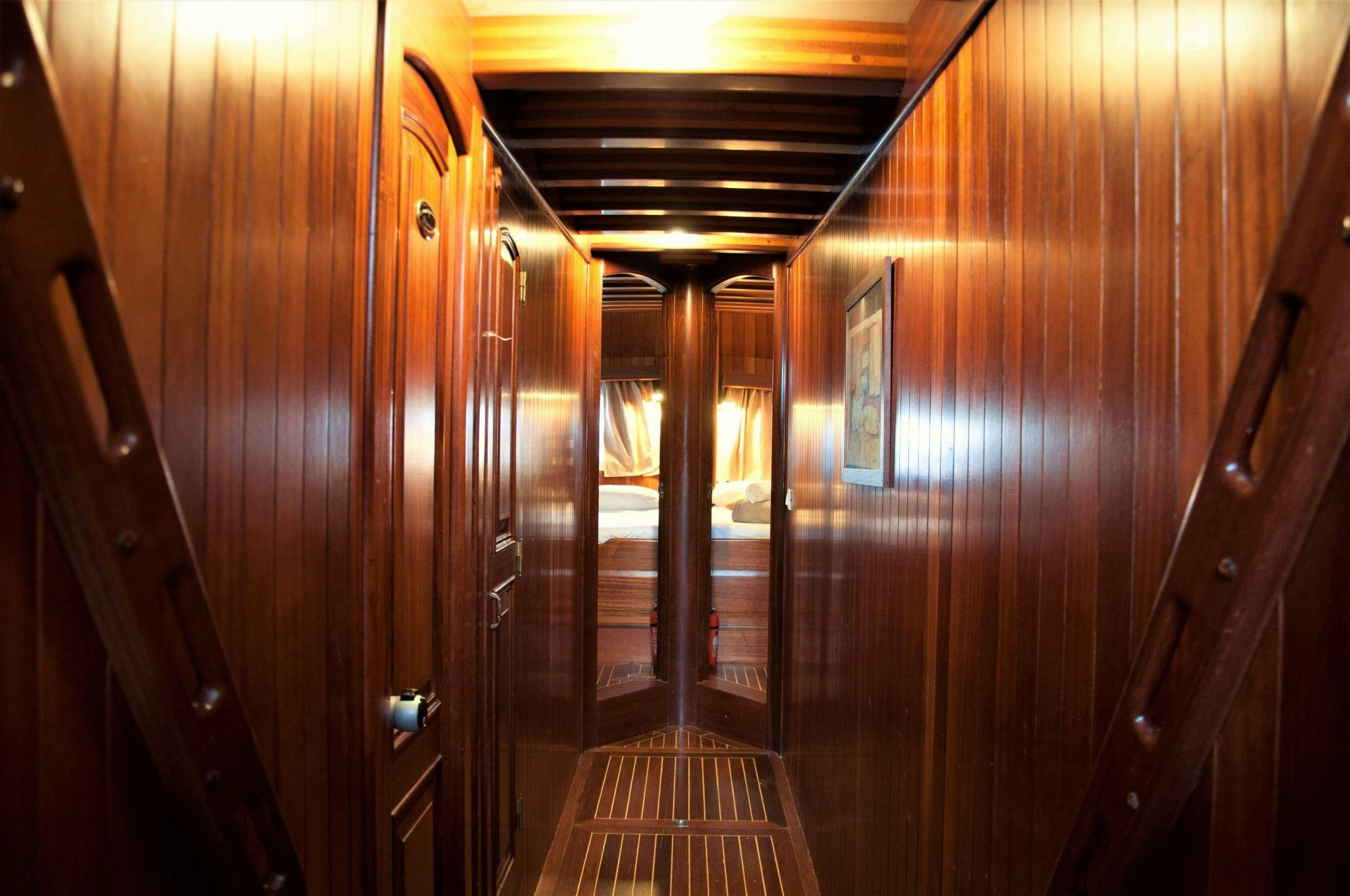 a wood hallway with wood doors aboard Donna Marisa Yacht for Charter