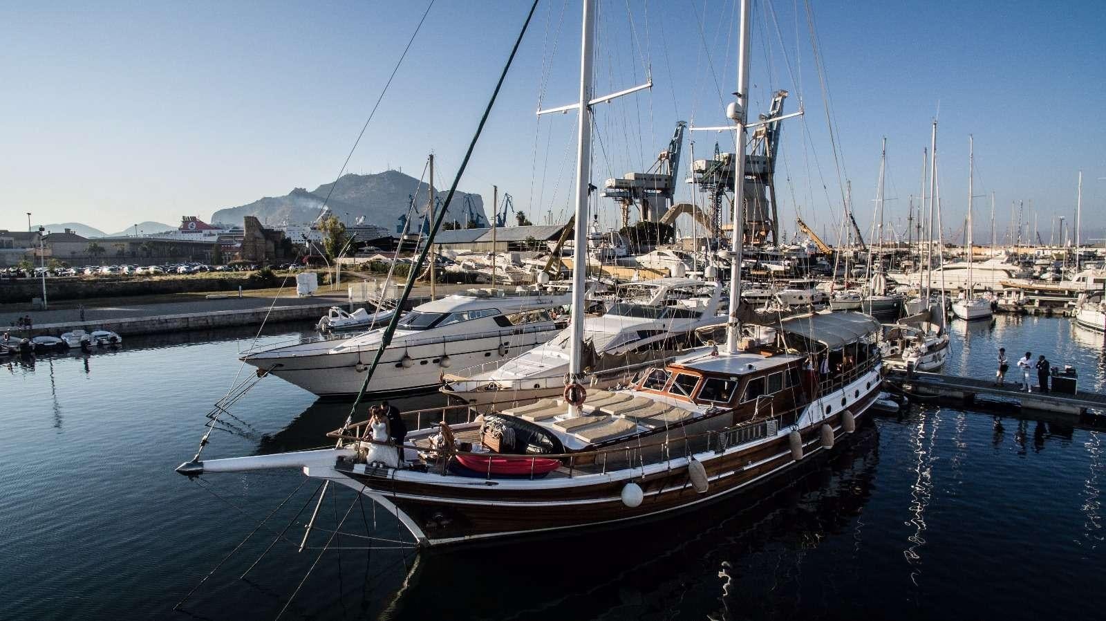 a group of boats are parked at a dock aboard Donna Marisa Yacht for Charter