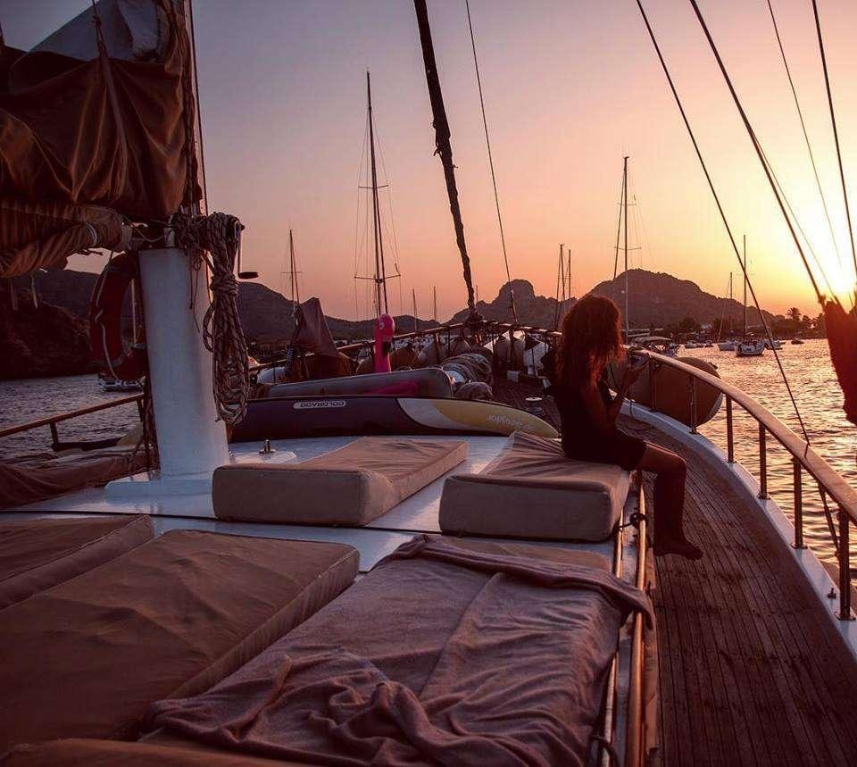 a person sitting on a boat aboard Donna Marisa Yacht for Charter