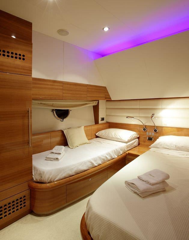 a room with two beds aboard GEORGE V Yacht for Charter