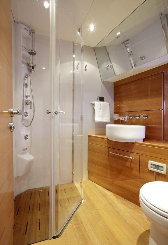a bathroom with a shower unit and sink aboard GEORGE V Yacht for Charter