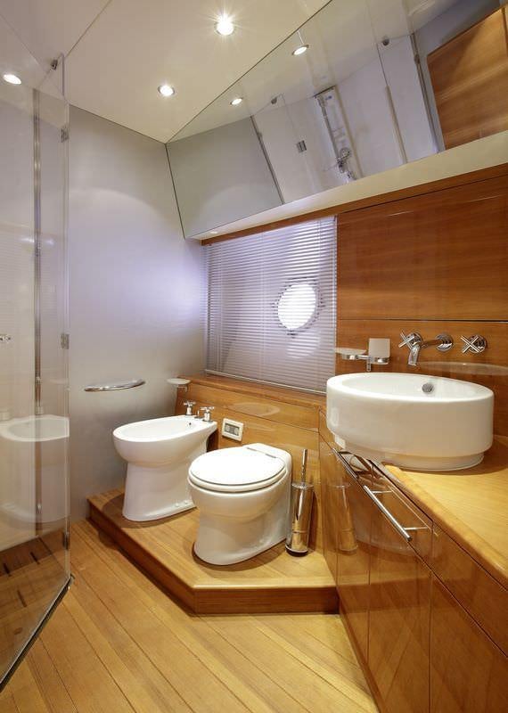 a bathroom with a toilet and sink aboard GEORGE V Yacht for Charter