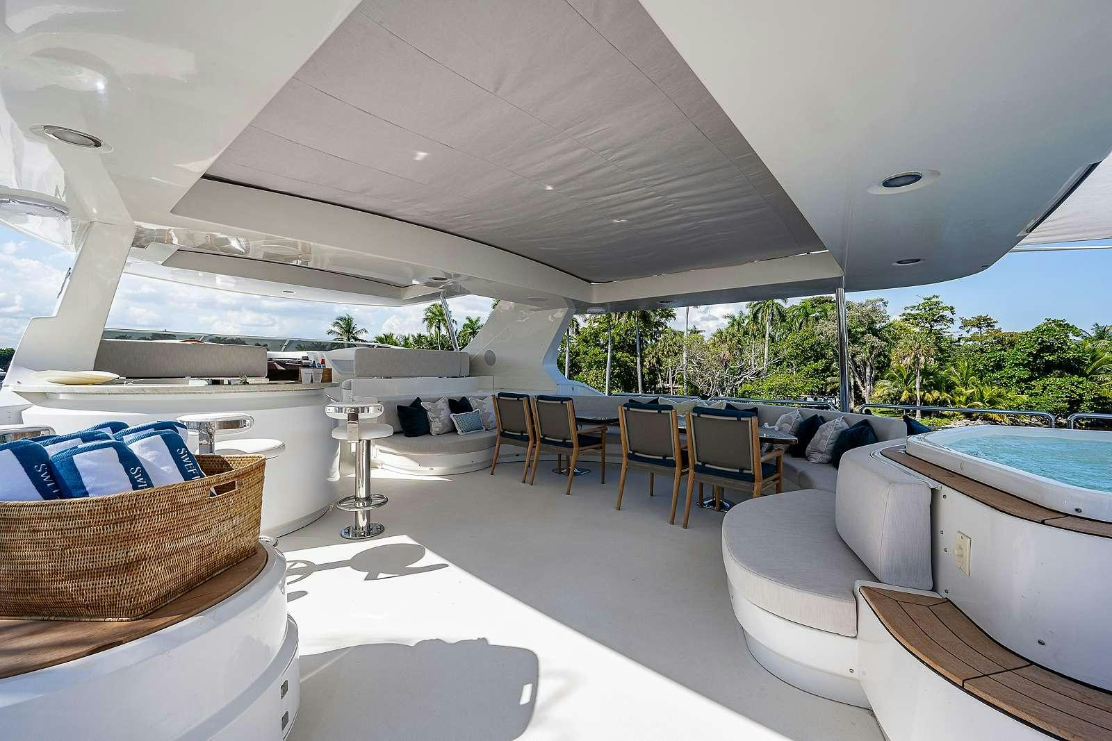 a room with a pool table and chairs aboard SWEET EMOCEAN Yacht for Charter