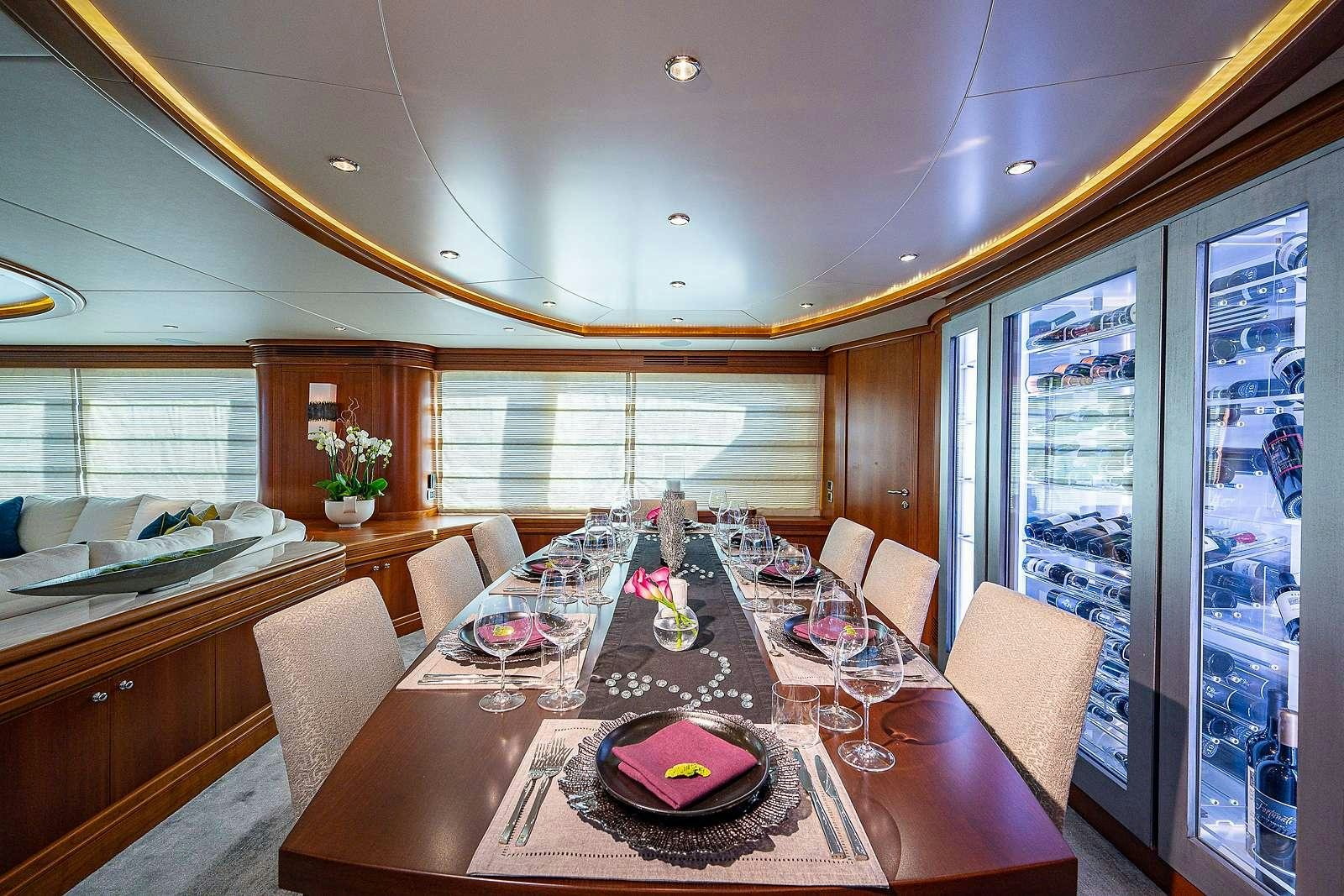 a large dining room with a large window aboard SWEET EMOCEAN Yacht for Charter